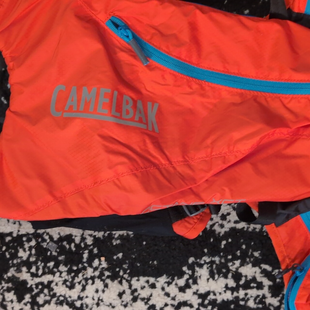 CamelBak Vibrant Orange Backpack with Blue Accents